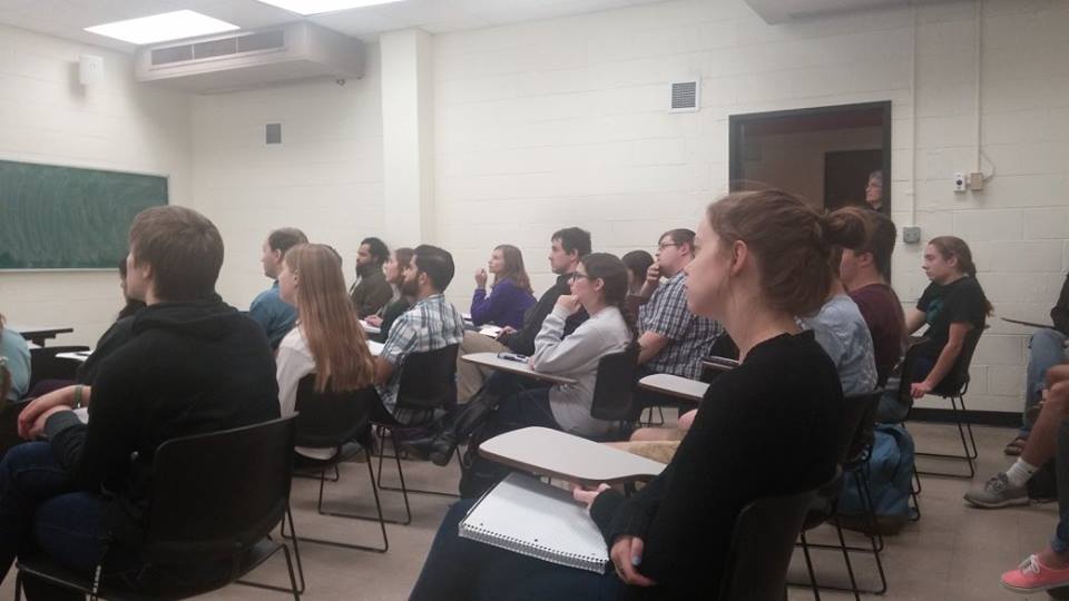 Students listening to a presentation.