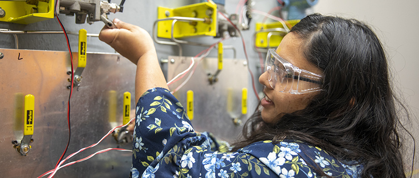 a female student works with eqipment